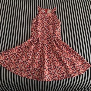 Pink dress with lighter pink flowers on it